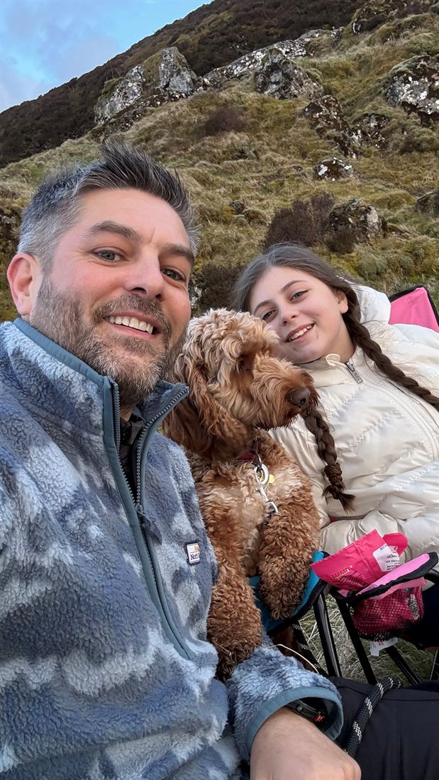 Chris, Nina and Bailey outdoors.